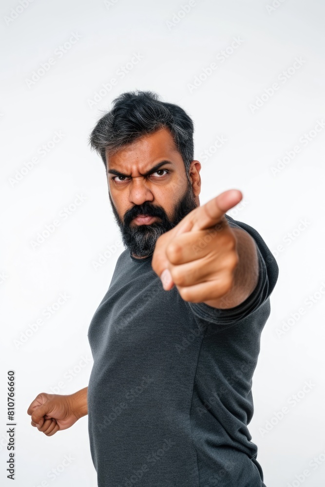 A bearded man menacingly points forward with his outstretched finger Fictional Character Created By Generative AI. A bearded man menacingly points forward with his outstretched finger Fictional Character Created By Generative AI.
