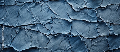 Copy space image featuring the striking texture of ripped denim jeans photo