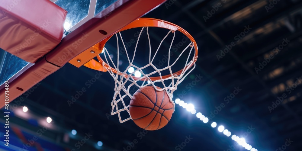 Basketball going through hoop in basketball court, closeup action shot photo. Basketball going through hoop in basketball court, closeup action shot photo.