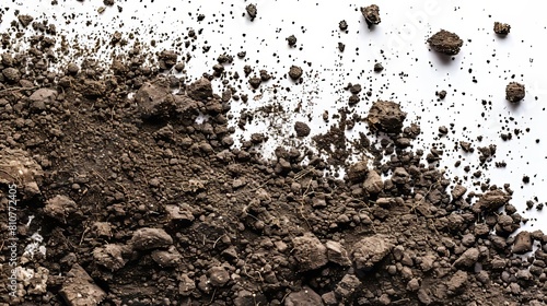Top view of flying soil dirt piles, meticulously scattered on a white background with studio lighting to capture detailed textures photo