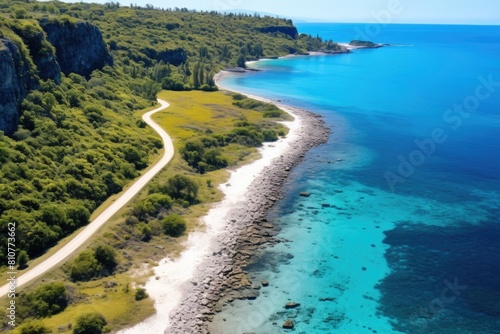 Nauru landscape. Stunning Aerial View of Coastal Road Along Turquoise Water and Lush Greenery.