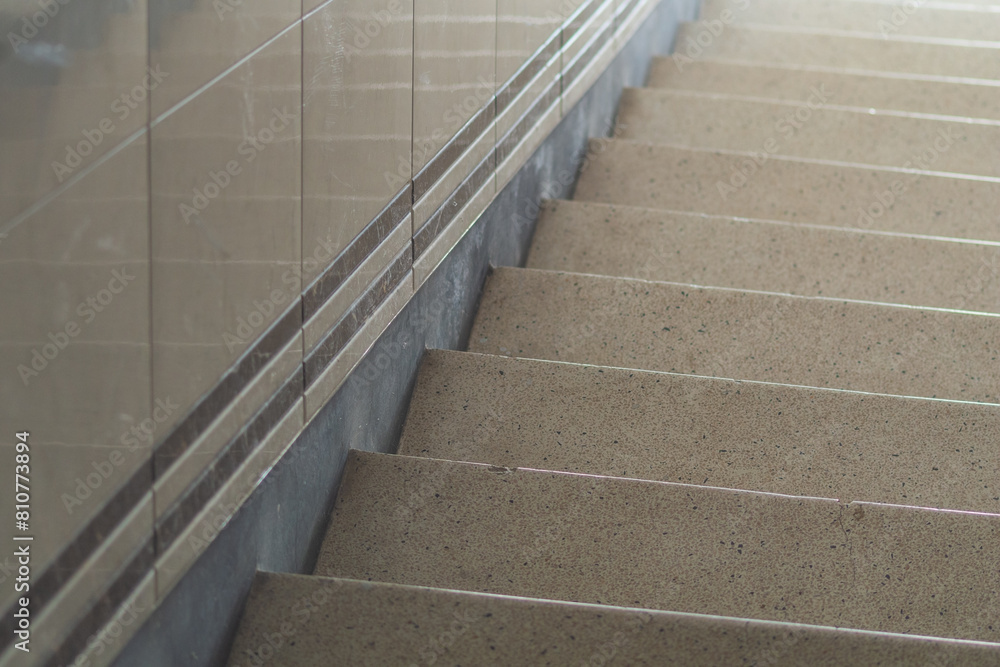 Fototapeta premium Detailed View of a Granite Staircase With Metal Handrail Inside a Building