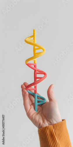 Título Modelo de hélice dupla de DNA segurado por uma mão photo