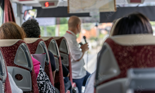 View of the passengers inside a stage coach bus. Bus interior trip. Transport, tourism and road trip concept.