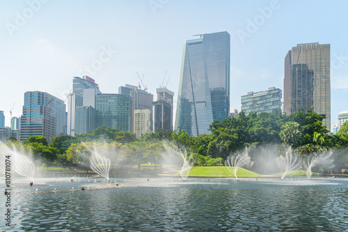 Scenic fountains in a green urban park of Kuala Lumpur © efired