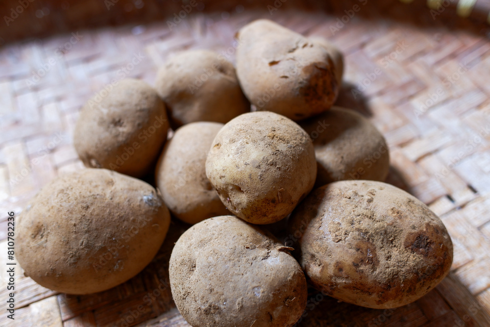 Freshly Harvested Potatoe on Woven Bamboo Tray, healthy food, stock photo. Freshly Harvested Potatoe on Woven Bamboo Tray, healthy food, stock photo.