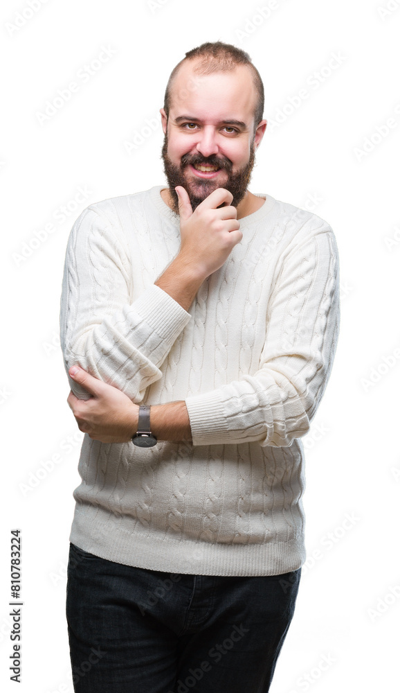 Young caucasian hipster man wearing winter sweater over isolated background looking confident at the camera with smile with crossed arms and hand raised on chin. Thinking positive. Young caucasian hipster man wearing winter sweater over isolated background looking confident at the camera with smile with crossed arms and hand raised on chin. Thinking positive.