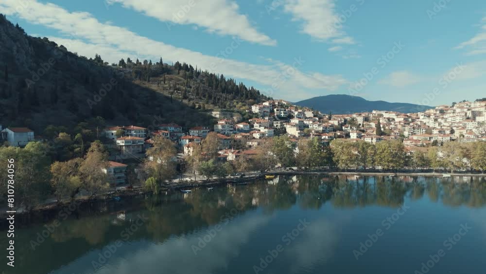 Drone orbit FLIGHT aside to a village on a hill in Europe, red roof tops, sunny weather, blue water lake, SCENIC mountains, Greece 4K dreamy video Drone orbit FLIGHT aside to a village on a hill in Europe, red roof tops, sunny weather, blue water lake, SCENIC mountains, Greece 4K dreamy video