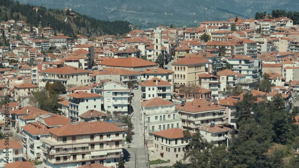 Drone flying close up, above a village on a green hill in Europe, red roof tops, little houses, sunny weather, Greece 4K video Drone flying close up, above a village on a green hill in Europe, red roof tops, little houses, sunny weather, Greece 4K video