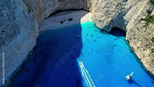 Aerial drone top down shot over an enclosed beach famously called the shipwreck bay in Zakynthos island, Greece on a sunny day. photo