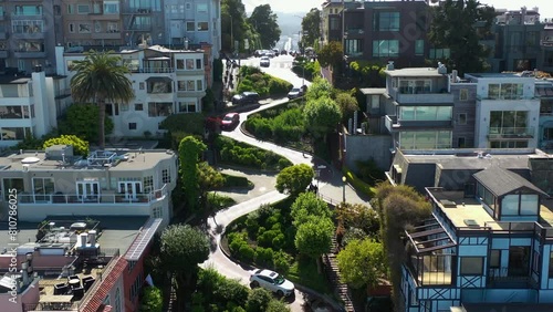 Drone rising over cars on the Lombard street, sunny day in San Francisco, USA