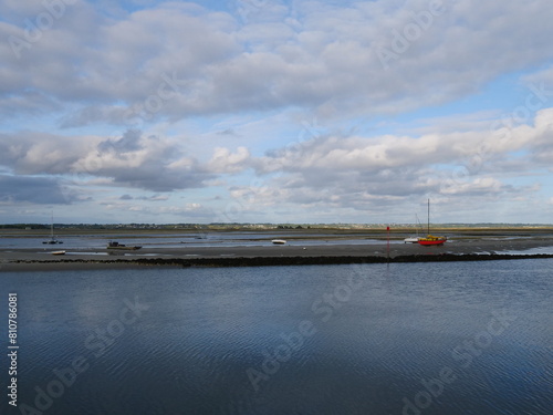 Coast of the Bay of Biscay, view from the harbor entrance from the town le Croisic, it is low tide some boats lie on the muddy sandy bottom of the sea and float again when the low tide goes out © Gerfried