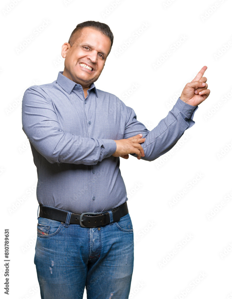 Middle age arab business man over isolated background with a big smile on face, pointing with hand and finger to the side looking at the camera. Middle age arab business man over isolated background with a big smile on face, pointing with hand and finger to the side looking at the camera.