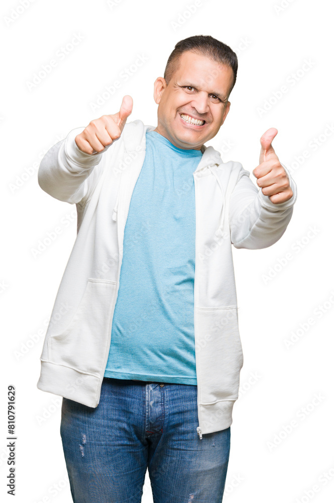 Middle age arab man wearing sweatshirt over isolated background approving doing positive gesture with hand, thumbs up smiling and happy for success. Looking at the camera, winner gesture. Middle age arab man wearing sweatshirt over isolated background approving doing positive gesture with hand, thumbs up smiling and happy for success. Looking at the camera, winner gesture.