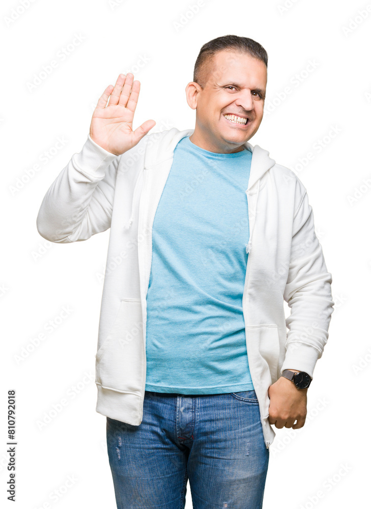 Middle age arab man wearing sweatshirt over isolated background Waiving saying hello happy and smiling, friendly welcome gesture Middle age arab man wearing sweatshirt over isolated background Waiving saying hello happy and smiling, friendly welcome gesture