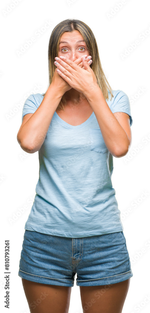 Young beautiful woman over isolated background shocked covering mouth with hands for mistake. Secret concept. Young beautiful woman over isolated background shocked covering mouth with hands for mistake. Secret concept.