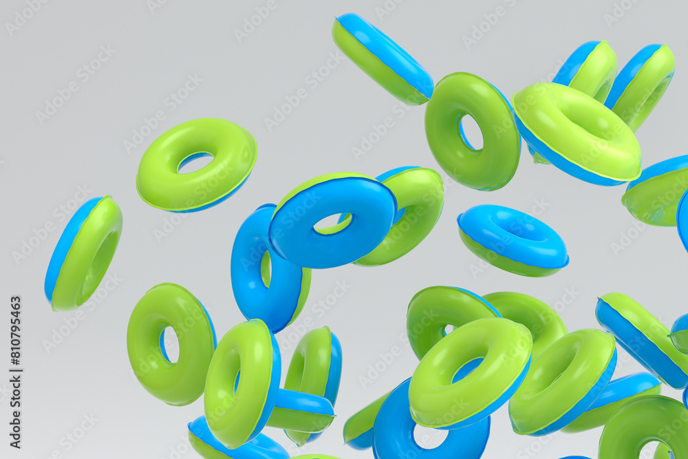 Fototapeta premium Many of flying inflatable ring for swimming pool isolated on white background