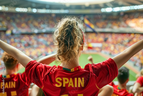 Spanish football soccer fans in a stadium supporting the national team, view from behind, La Selección, La Furia Roja
 photo