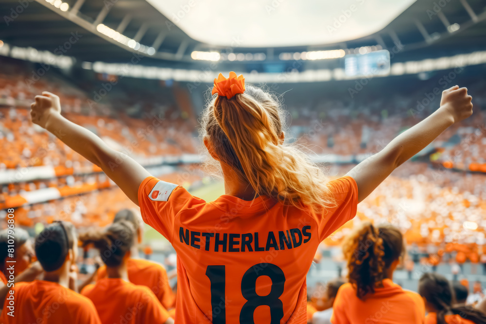 Dutch football soccer fans in a stadium supporting the national team, view from behind, Oranje 
