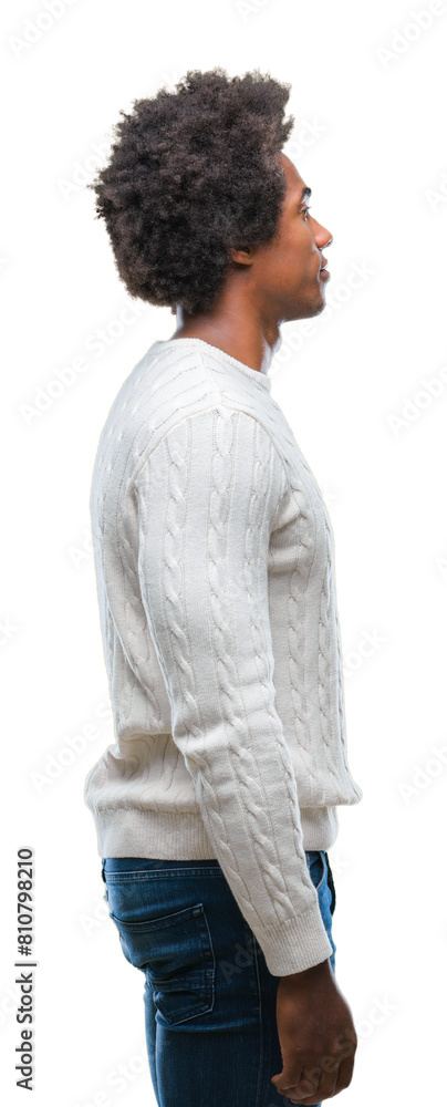 Afro american man over isolated background looking to side, relax profile pose with natural face with confident smile. Afro american man over isolated background looking to side, relax profile pose with natural face with confident smile.