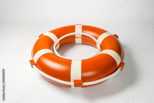 An isolated bright orange lifebuoy with white stripes and a rope, symbolizing safety and rescue