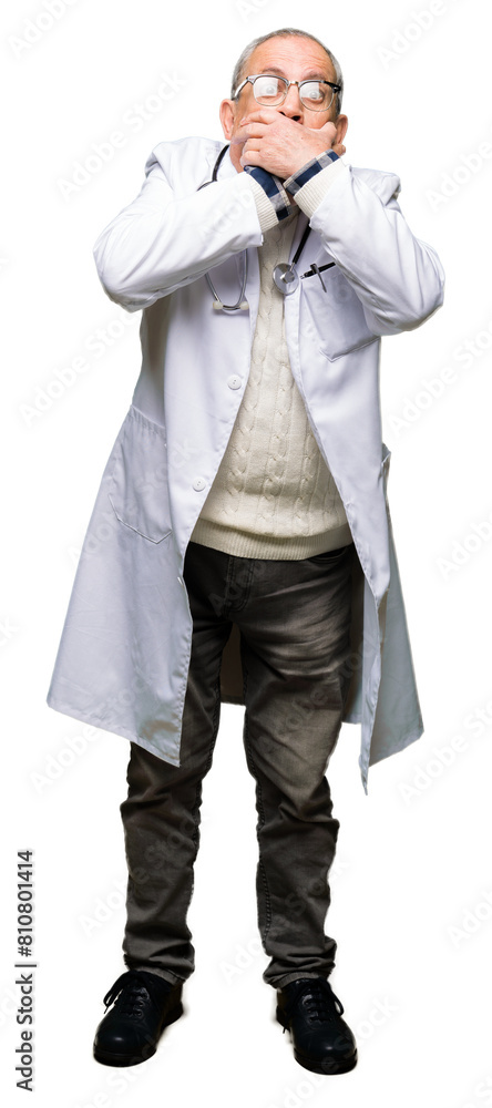 Handsome senior doctor man wearing medical coat shocked covering mouth with hands for mistake. Secret concept. Handsome senior doctor man wearing medical coat shocked covering mouth with hands for mistake. Secret concept.
