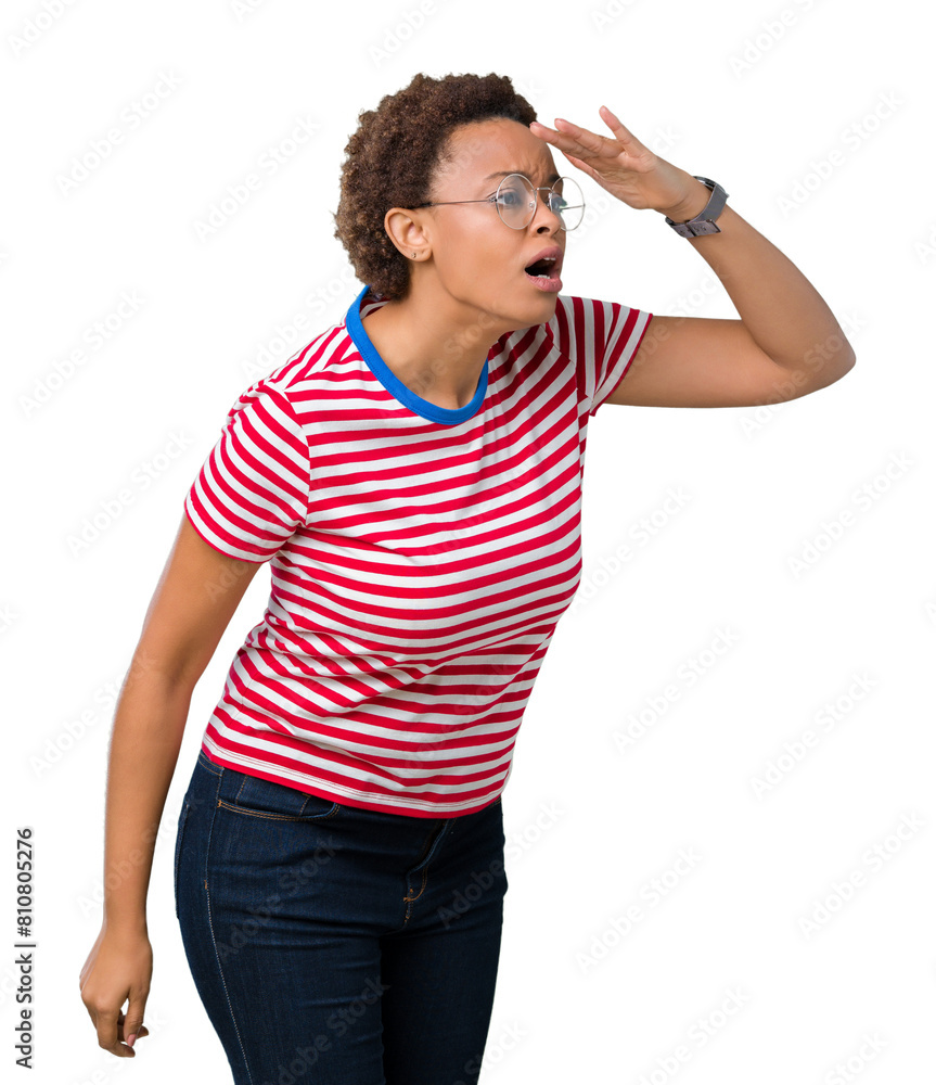 Beautiful young african american woman wearing glasses over isolated background very happy and smiling looking far away with hand over head. Searching concept. Beautiful young african american woman wearing glasses over isolated background very happy and smiling looking far away with hand over head. Searching concept.