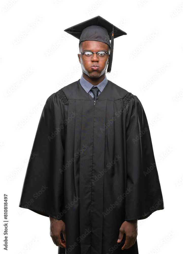 Young graduated african american man over isolated background puffing cheeks with funny face. Mouth inflated with air, crazy expression. Young graduated african american man over isolated background puffing cheeks with funny face. Mouth inflated with air, crazy expression.