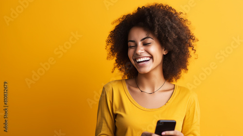  cheerful cheery wavy-haired girl using cell creating blog smm repost isolated over bright vivid shine vibrant yellow color background