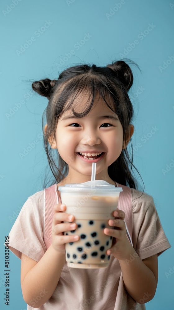 thai girl holding her boba bubble tea and smiling thai girl holding her boba bubble tea and smiling
