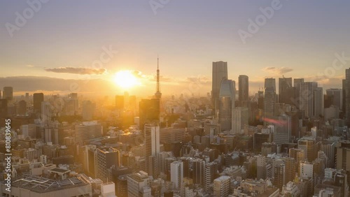 tokyo city downtown aerial view time lapse from day to night,modern metropolis town with high rise buildings timelapse at sunset photo