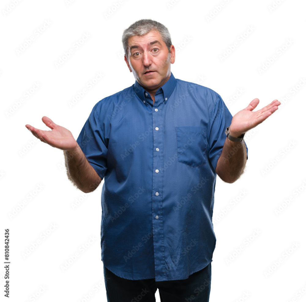 Handsome senior man over isolated background clueless and confused expression with arms and hands raised. Doubt concept. Handsome senior man over isolated background clueless and confused expression with arms and hands raised. Doubt concept.
