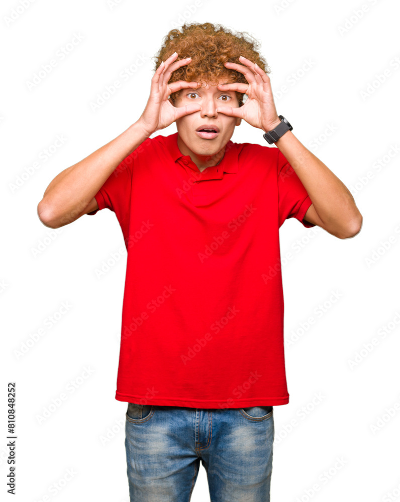 Young handsome man with afro hair wearing red t-shirt Trying to open eyes with fingers, sleepy and tired for morning fatigue Young handsome man with afro hair wearing red t-shirt Trying to open eyes with fingers, sleepy and tired for morning fatigue