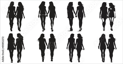 Silhouettes of two young women walking together holding hands, Two young women holding hands walking silhouettes, Silhouette of two women holding hands, Two people, Women, Walking, Friends, Friendship