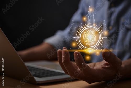 Yellow Cyber Identity Data or Biometric Fingerprint Technology Concept and Internet Security Systems. Fingerprint in Cybersecurity HUD and Circuit Line with Laptop