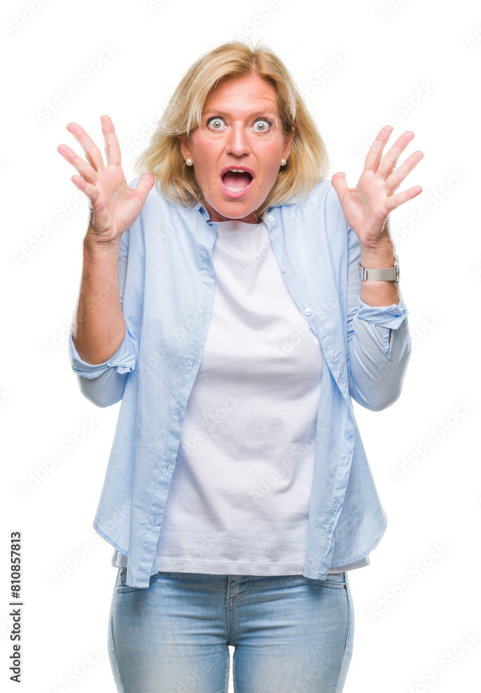 Middle age blonde woman over isolated background celebrating crazy and amazed for success with arms raised and open eyes screaming excited. Winner concept Middle age blonde woman over isolated background celebrating crazy and amazed for success with arms raised and open eyes screaming excited. Winner concept
