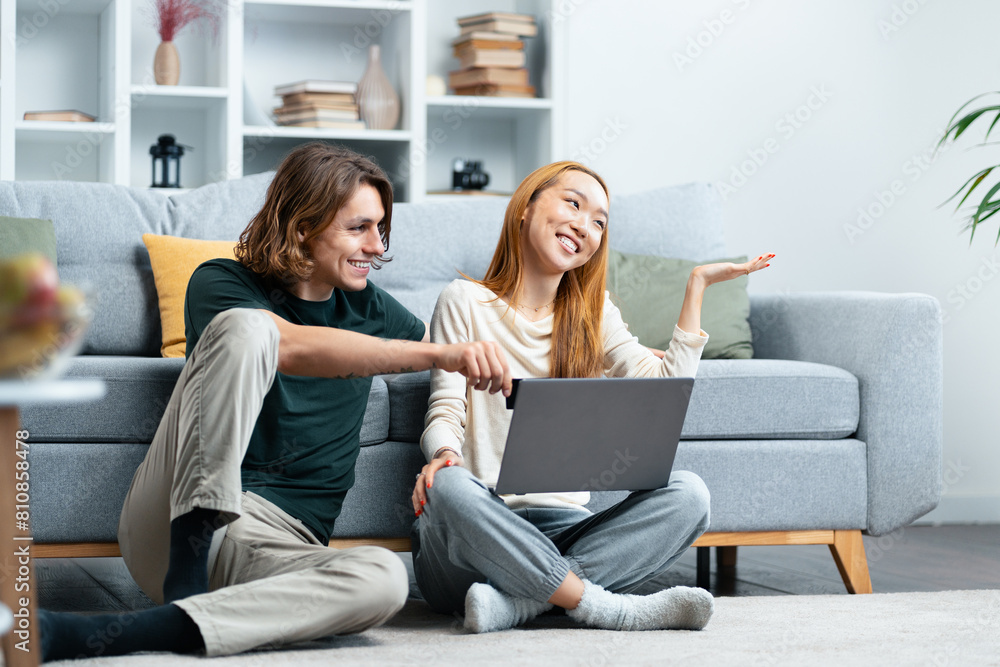 Happy Couple Relaxing With Laptop At Home, Enjoying Time Together, Casual Lifestyle, Modern Living Room Happy Couple Relaxing With Laptop At Home, Enjoying Time Together, Casual Lifestyle, Modern Living Room