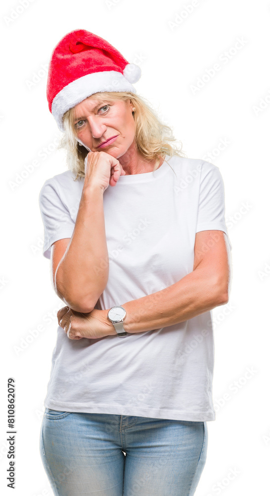 Middle age blonde woman wearing christmas hat over isolated background thinking looking tired and bored with depression problems with crossed arms. Middle age blonde woman wearing christmas hat over isolated background thinking looking tired and bored with depression problems with crossed arms.