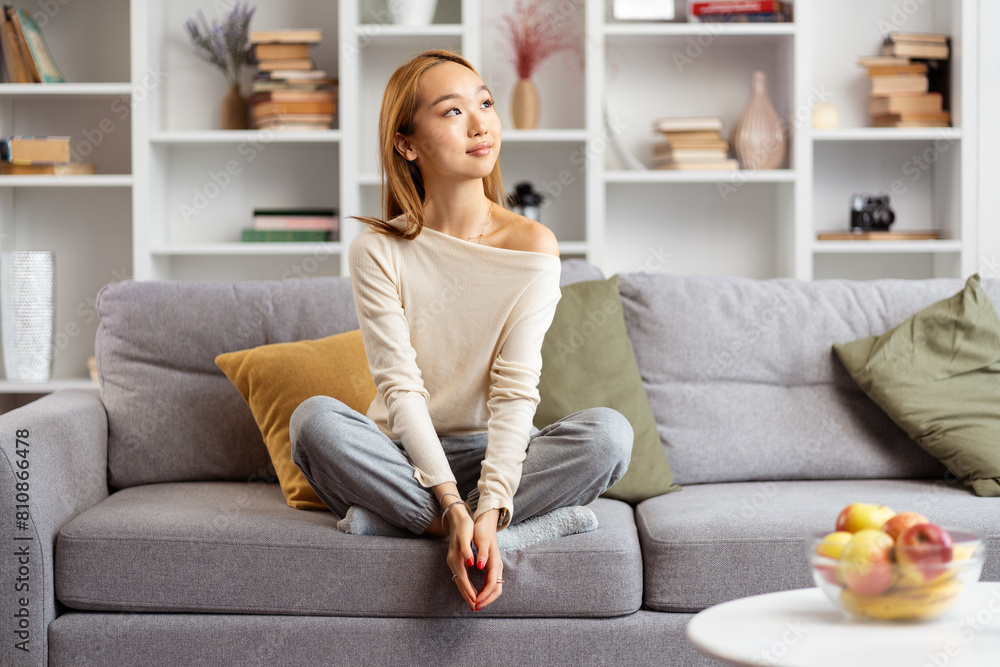Young Woman Relaxing On Sofa In Modern Living Room, Peaceful, Comfortable, Stylish Interior, Casual Wear, Daydreaming, Home Decor Young Woman Relaxing On Sofa In Modern Living Room, Peaceful, Comfortable, Stylish Interior, Casual Wear, Daydreaming, Home Decor