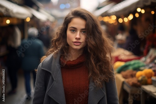 Wallpaper Mural Portrait of a content woman in her 20s dressed in a warm wool sweater in bustling urban market Torontodigital.ca