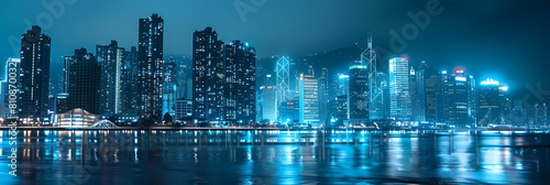 luminous urban landscapes at night featuring a serene blue sky and calm waters, with a prominent tall building in the foreground