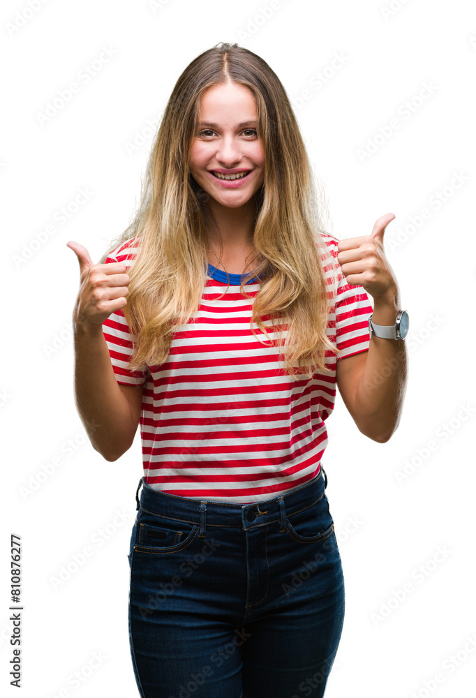 Young beautiful blonde woman over isolated background success sign doing positive gesture with hand, thumbs up smiling and happy. Looking at the camera with cheerful expression, winner gesture. Young beautiful blonde woman over isolated background success sign doing positive gesture with hand, thumbs up smiling and happy. Looking at the camera with cheerful expression, winner gesture.