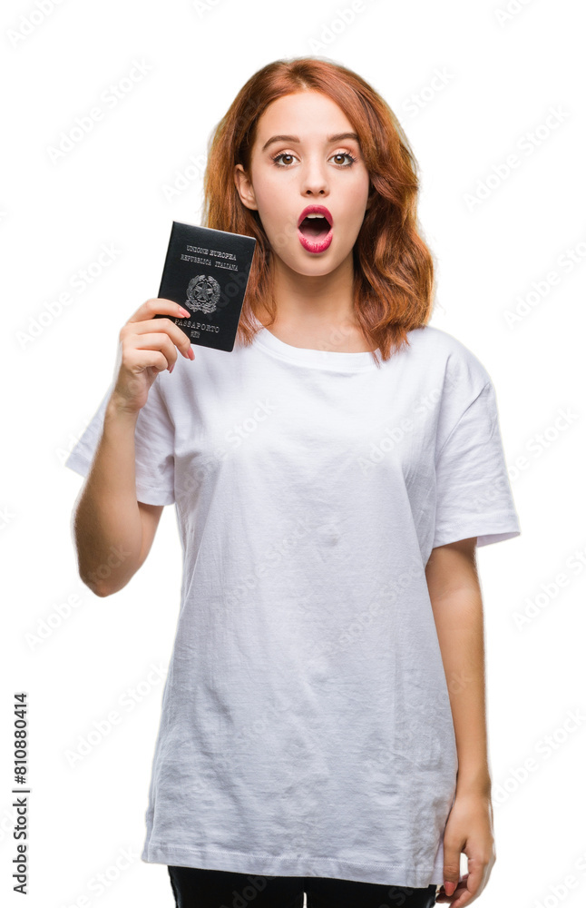 Young beautiful woman holding passport of italy over isolated background scared in shock with a surprise face, afraid and excited with fear expression Young beautiful woman holding passport of italy over isolated background scared in shock with a surprise face, afraid and excited with fear expression