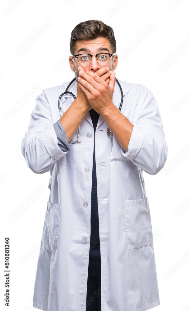 Young handsome doctor man over isolated background shocked covering mouth with hands for mistake. Secret concept. Young handsome doctor man over isolated background shocked covering mouth with hands for mistake. Secret concept.