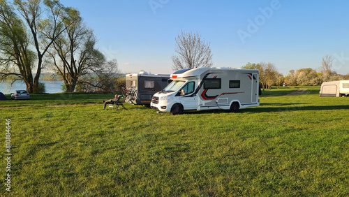 Campers parked on a Camer Van pitch. Concept camper van leisure and fun