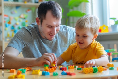father and son playing blocks