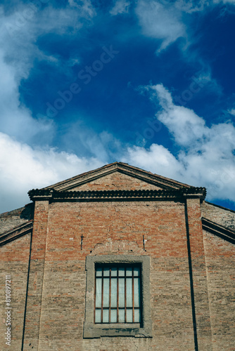 Church exterior with blue sky and clouds