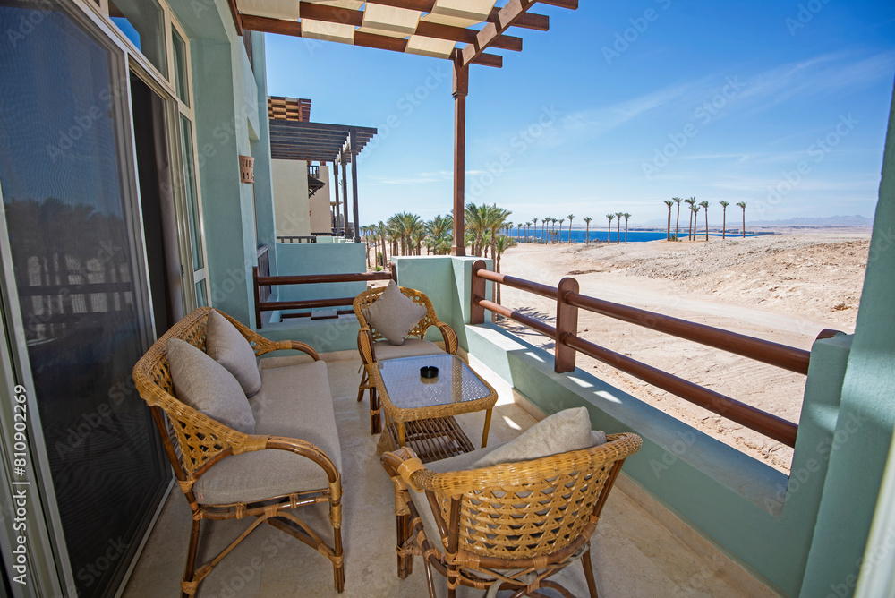Fototapeta premium Terrace balcony with chairs in tropical luxury apartment resort