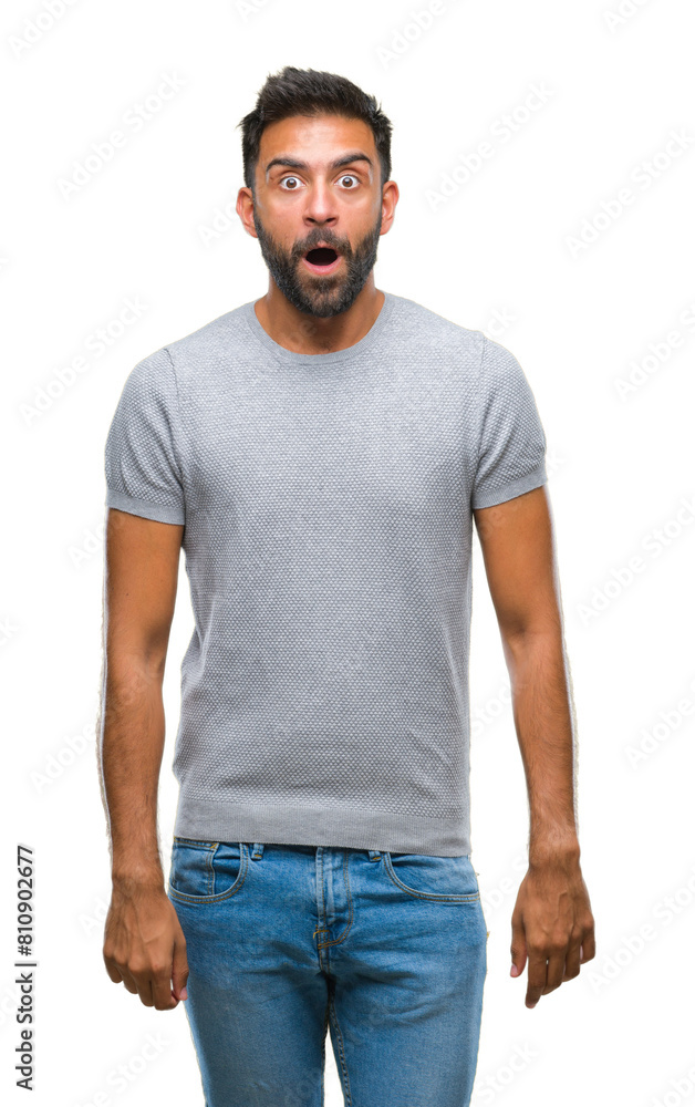 Adult hispanic man over isolated background afraid and shocked with surprise expression, fear and excited face. Adult hispanic man over isolated background afraid and shocked with surprise expression, fear and excited face.