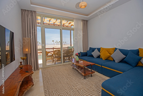 Interior design of luxury apartment living room with balcony